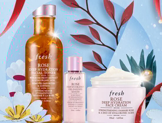 Fresh's advent calendar gift set open to display a selection of products against a light blue background