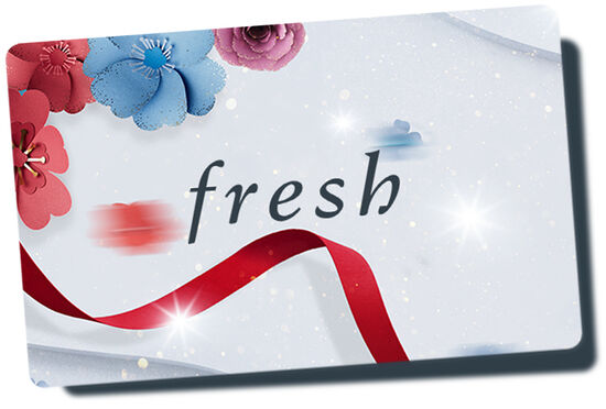 Patterned Fresh gift card overlaid on top of red ribbon against a white background.
