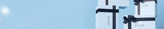 Several Fresh light blue gift boxes on a background of the same color.
