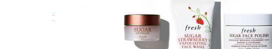 Two tubs of sugar polish products and one tube of Sugar Strawberry Face wash on a white background