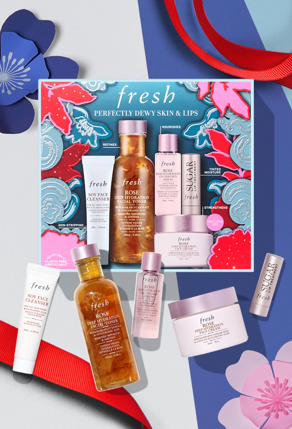 fresh holiday gift set against blue background and red ribbon