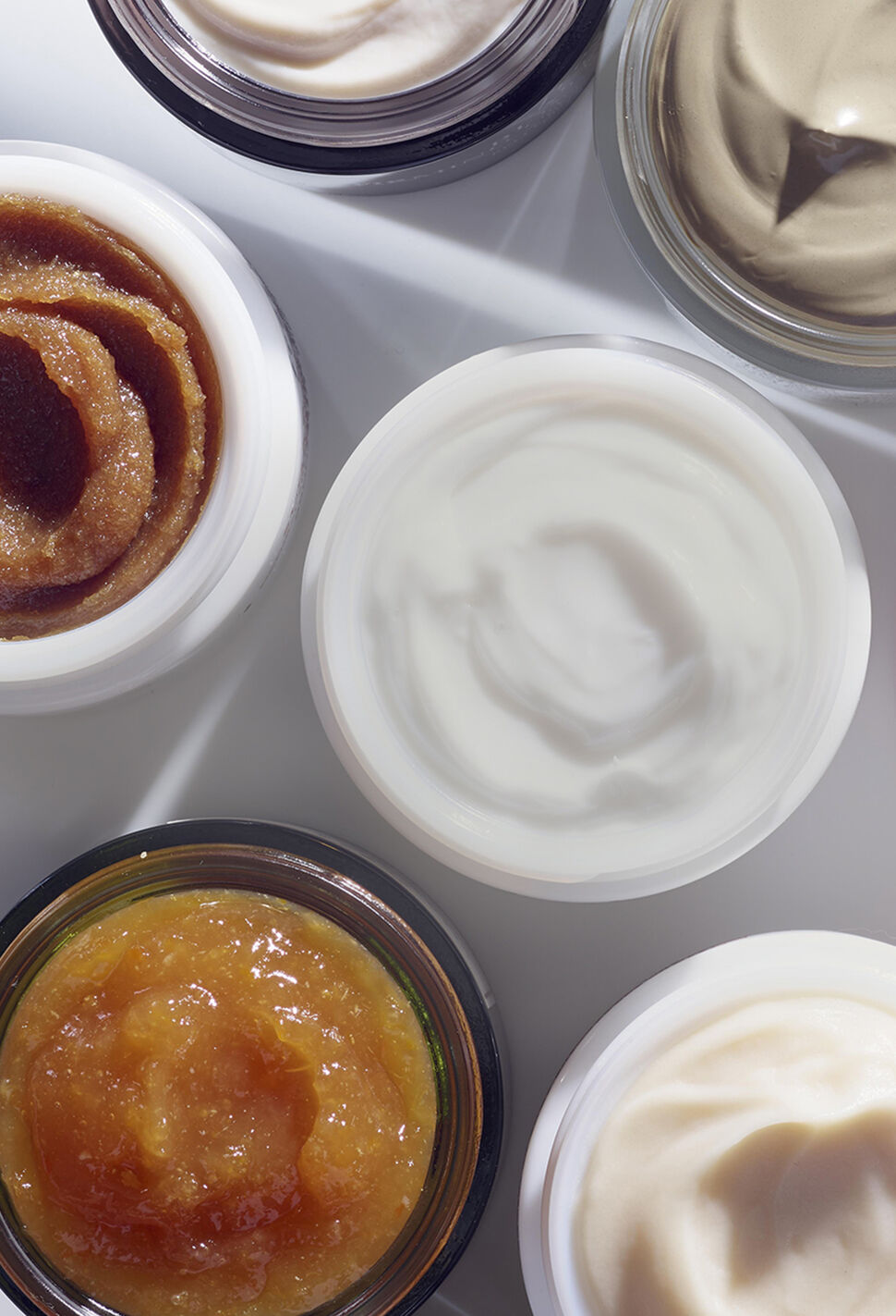 Bird's eye view of fresh face masks of varying textures