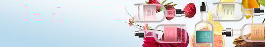 A light blue banner showing a range of Fresh fragrances with various fruit behind each product.